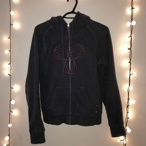 black zip up hoodie with burgundy logo